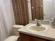 Bathroom with single sink vanity and shower/tub combo at 142 Winghurst Blvd, Orlando, FL 32828