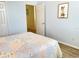 Spacious bedroom with a queen bed and access to another room at 142 Winghurst Blvd, Orlando, FL 32828