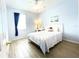 Charming bedroom with light walls and a queen bed at 142 Winghurst Blvd, Orlando, FL 32828