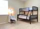 Bedroom with a bunk bed and adjacent desk and chair at 142 Winghurst Blvd, Orlando, FL 32828