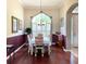 Formal dining room with hardwood floors and an arched window at 142 Winghurst Blvd, Orlando, FL 32828