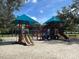 Two playground structures with slides and shade covers at 142 Winghurst Blvd, Orlando, FL 32828