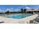 Community pool with plenty of lounge chairs at 142 Winghurst Blvd, Orlando, FL 32828