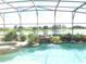 Relaxing pool and spa with a waterfall, offering scenic views at 142 Winghurst Blvd, Orlando, FL 32828