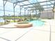 Inviting pool area with spa and screened enclosure at 142 Winghurst Blvd, Orlando, FL 32828