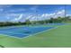 Two well-maintained tennis courts at 142 Winghurst Blvd, Orlando, FL 32828