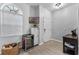 Bright entryway with mini fridge, console table, and wicker basket at 1449 Ashdown Ct, Sanford, FL 32771