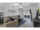 Relaxing living room featuring a sectional sofa and sliding glass doors to patio at 1449 Ashdown Ct, Sanford, FL 32771