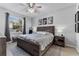 Spacious main bedroom with a king-size bed and en-suite bathroom at 1449 Ashdown Ct, Sanford, FL 32771