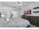 Main bedroom featuring a king-size bed and barn door to bathroom at 1449 Ashdown Ct, Sanford, FL 32771