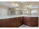 Double vanity bathroom with corner sink and large mirror at 148 Calliope St, Ocoee, FL 34761