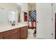 Small bathroom with shower and American flag shower curtain at 148 Calliope St, Ocoee, FL 34761