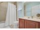 Clean bathroom with a shower/tub combo and wood vanity at 148 Calliope St, Ocoee, FL 34761