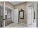 Hallway with decorative mirror and access to other rooms at 148 Calliope St, Ocoee, FL 34761