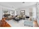 Bright living room with tile floors, sofas, and a coffee table at 148 Calliope St, Ocoee, FL 34761