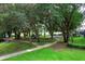 Community playground nestled among lush trees at 148 Calliope St, Ocoee, FL 34761