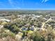 Broad aerial view of the property and surrounding landscape and neighborhood at 1480 Battle St, Oviedo, FL 32765