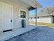 Back patio with pavers and exterior door at 1480 Battle St, Oviedo, FL 32765