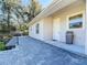 Back patio with pavers and exterior door at 1480 Battle St, Oviedo, FL 32765