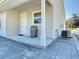 Back patio with pavers and exterior door at 1480 Battle St, Oviedo, FL 32765