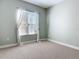 Bright bedroom with carpeted floor, window with curtains, and neutral walls at 1480 Battle St, Oviedo, FL 32765