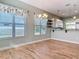 Bright dining room with wood-like tile floors and kitchen view at 1480 Battle St, Oviedo, FL 32765