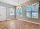 Bright dining room features wood-look tile floors and large windows at 1480 Battle St, Oviedo, FL 32765