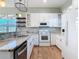 Modern kitchen with white cabinets and granite countertops at 1480 Battle St, Oviedo, FL 32765