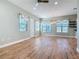 Spacious living area with wood-look tile floors and multiple windows at 1480 Battle St, Oviedo, FL 32765