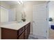 Bathroom with vanity, sink, and door at 1552 Carey Palm Cir, Kissimmee, FL 34747