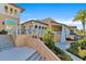 Exterior view of community clubhouse with stairs and landscaping at 1552 Carey Palm Cir, Kissimmee, FL 34747