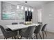 Elegant dining room with modern table and gray chairs at 1552 Carey Palm Cir, Kissimmee, FL 34747