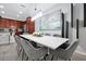 Elegant dining room with modern table and gray chairs at 1552 Carey Palm Cir, Kissimmee, FL 34747