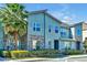 Modern 2-story townhome with stone accents and palm trees at 1552 Carey Palm Cir, Kissimmee, FL 34747