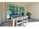 Outdoor patio with table, chairs, and grill at 1552 Carey Palm Cir, Kissimmee, FL 34747