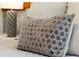 Close up of a gray and beige patterned pillow at 1552 Carey Palm Cir, Kissimmee, FL 34747