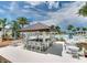 Relaxing poolside bar with seating for guests at 1552 Carey Palm Cir, Kissimmee, FL 34747