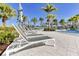 Spacious pool deck with lounge chairs for relaxation at 1552 Carey Palm Cir, Kissimmee, FL 34747