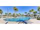 Resort-style pool with lounge chairs and umbrellas at 1552 Carey Palm Cir, Kissimmee, FL 34747