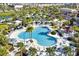 Aerial view of resort-style pool with lounge chairs and umbrellas at 1552 Carey Palm Cir, Kissimmee, FL 34747