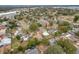 Aerial view of residential neighborhood featuring houses with yards and pools at 1630 Smithfield E Cir, Lakeland, FL 33801