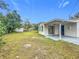 Large backyard with covered patio and shed at 1630 Smithfield E Cir, Lakeland, FL 33801