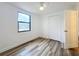 Simple bedroom with vinyl flooring, double door closet, and ceiling fan at 1630 Smithfield E Cir, Lakeland, FL 33801