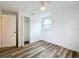 Bedroom with vinyl flooring, closet, and ceiling fan at 1630 Smithfield E Cir, Lakeland, FL 33801