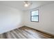 Bright bedroom with vinyl wood flooring, ceiling fan, and window at 1630 Smithfield E Cir, Lakeland, FL 33801