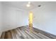 Clean bedroom featuring vinyl flooring and an open door to hallway at 1630 Smithfield E Cir, Lakeland, FL 33801