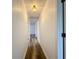 Clean hallway with light wood-look flooring at 1630 Smithfield E Cir, Lakeland, FL 33801