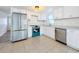 Modern kitchen featuring stainless steel appliances and white cabinets at 1630 Smithfield E Cir, Lakeland, FL 33801