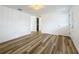 Spacious living room featuring new flooring and doors at 1630 Smithfield E Cir, Lakeland, FL 33801