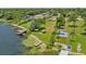 Aerial view of waterfront property with lake access, boat dock, and large backyard at 1638 Frances Dr, Apopka, FL 32703